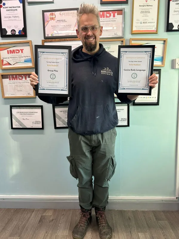 kris holding training certificates